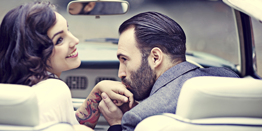 gentleman-kissing-ladys-hand-in-car