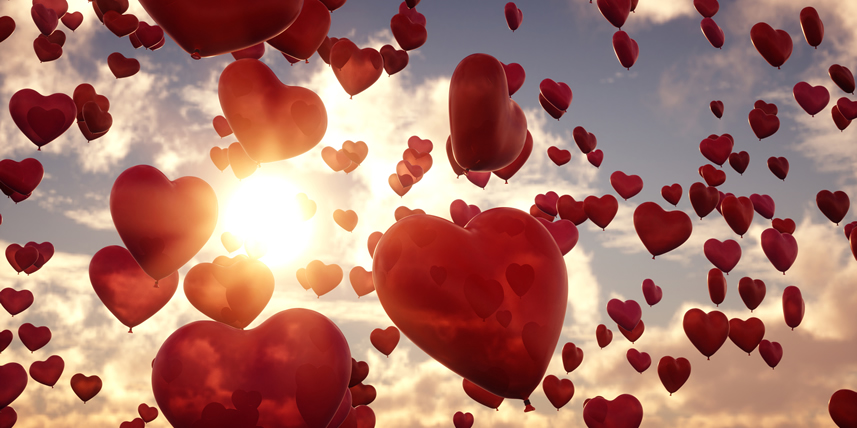 red-heart-balloons-flying-in-the-sky