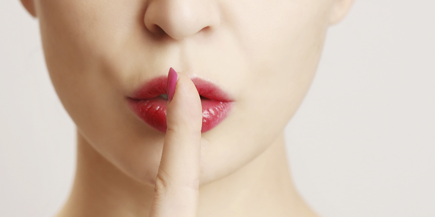 woman-hushing-with-finger-on-lips