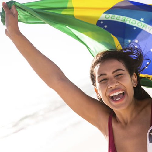 young-brazilian-woman-with-flag-and-football