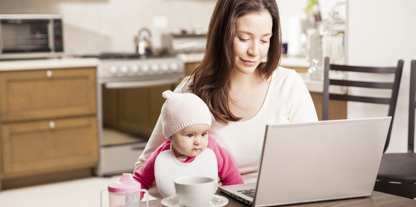 young-mother-with-laptop-and-baby-on-her-lap